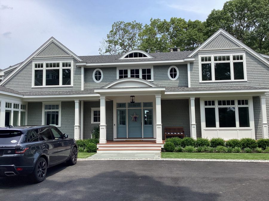 Gray home with white trim in Duxbury Preview Image 1