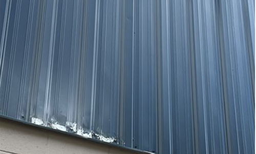 Damaged Exterior Metal Siding