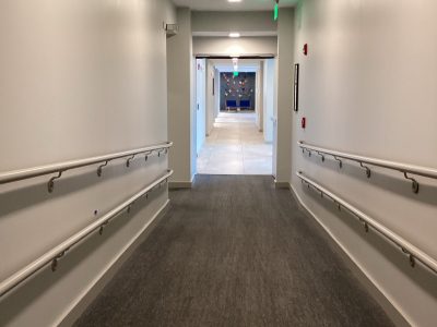 long hallway with safety rails on the side of the walls