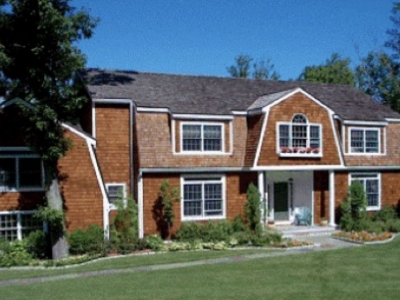 Home with stained cedar shingles and white trim
