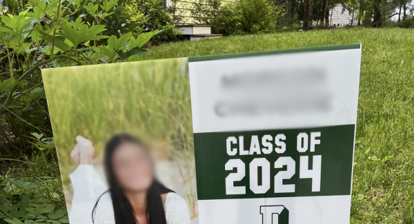 Photo of young lady on a 2024 graduation sign for Duxbury High School