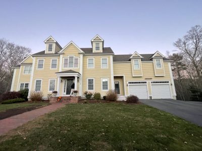 Pale yellow home with white trim