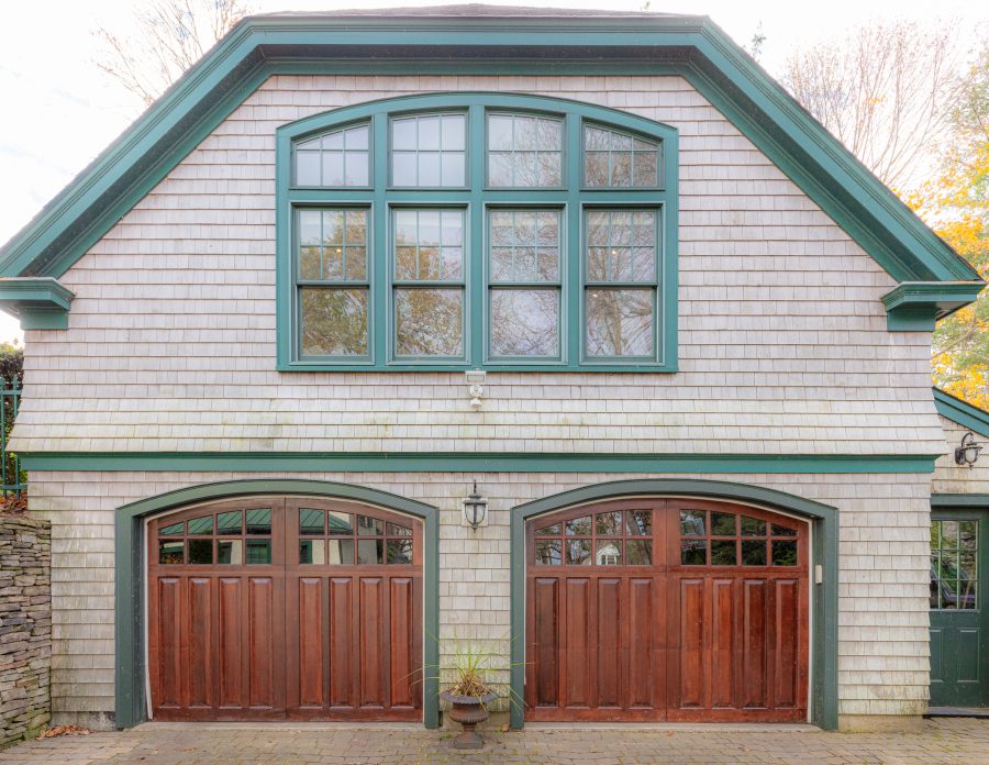 stained garage doors on white painted brick home Preview Image 2