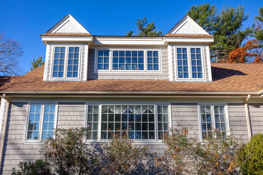 Side of home with gray shingles and white window trim Preview Image 5