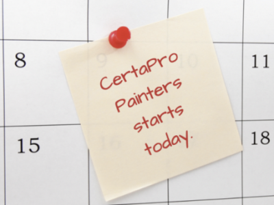 Calendar with post it note that says 