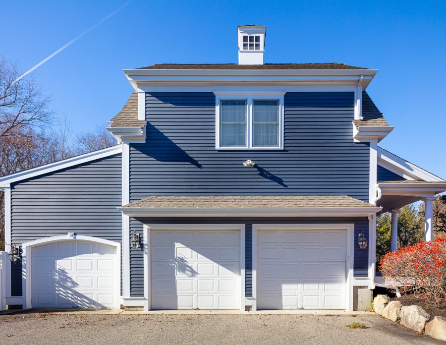 Side of home with garage doors, newly painted by CertaPro Painters Preview Image 2