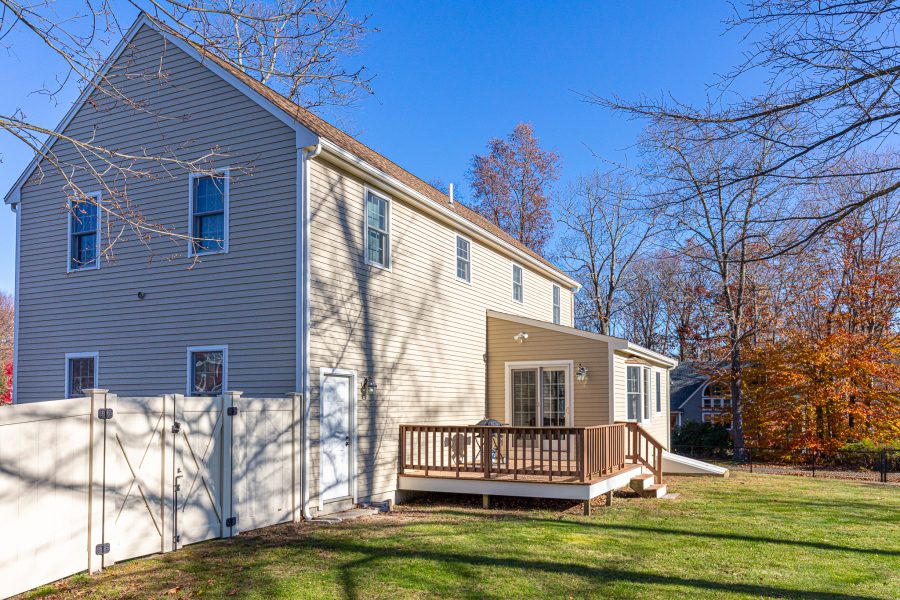 Home with newly painted exterior and deck in back yard. Preview Image 1