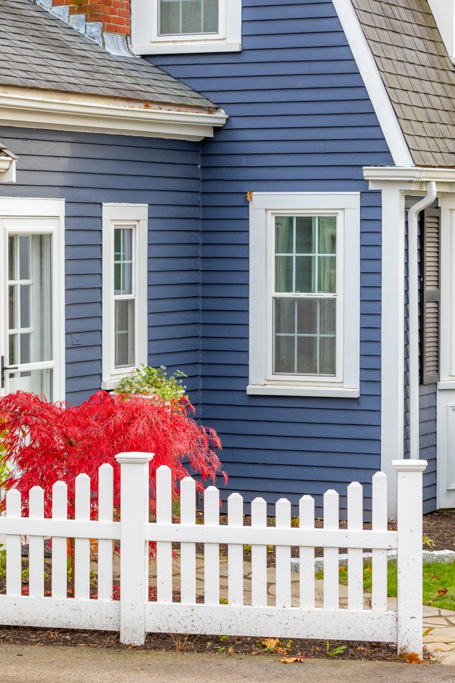 white fence and blue and white painted home Preview Image 7