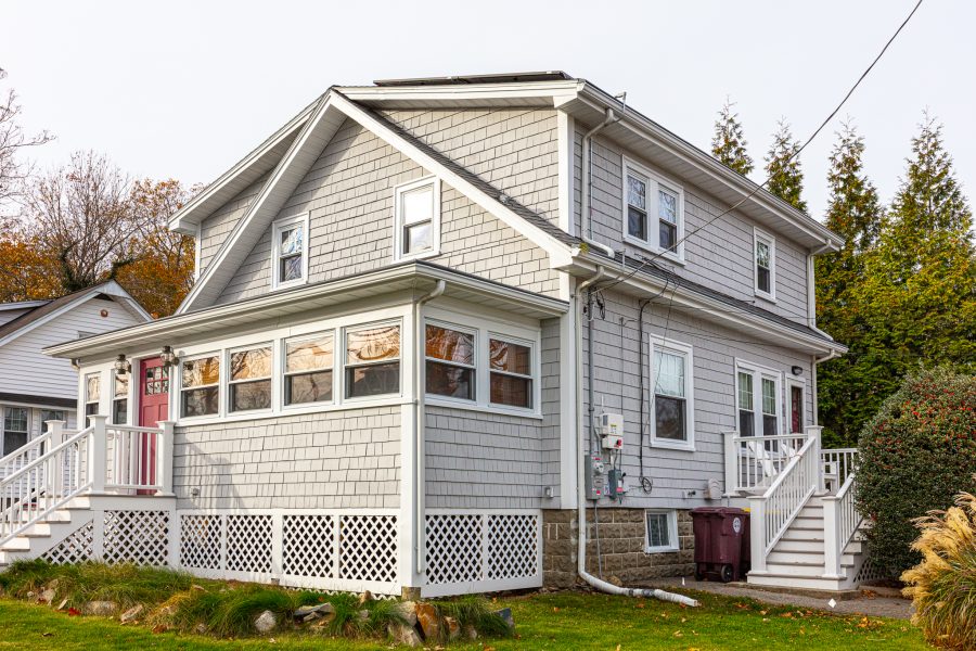 corner view of newly painted and stained home, white exterior Preview Image 2