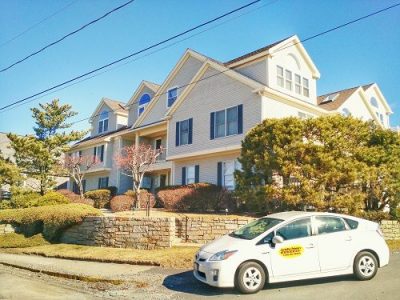 CertaPro White Prius car in front of off-white home