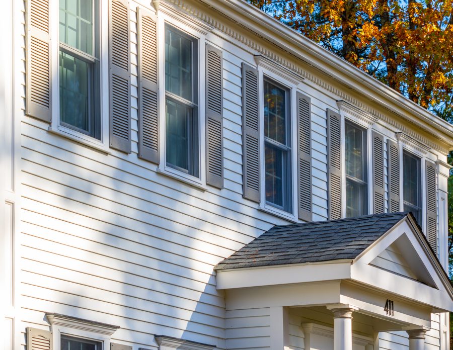 Gray shutters on white siding home Preview Image 4