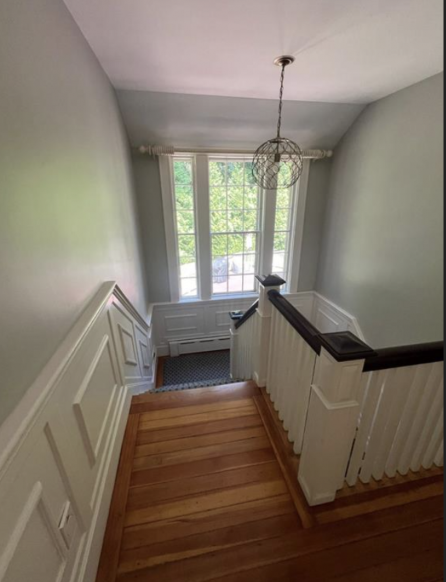 Stairwell with walls, trim, and railings painted. Preview Image 1