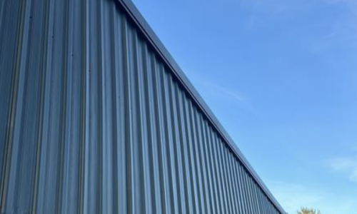 Repaired & Painted Metal Siding Exterior