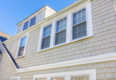 Close view of roof line and window trim after painting white.