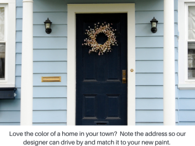 Light blue-gray home with black front door and cream pillars
