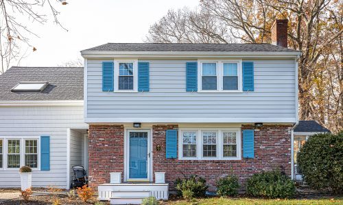 Brick Lower Level With Clapboards on Upper Level