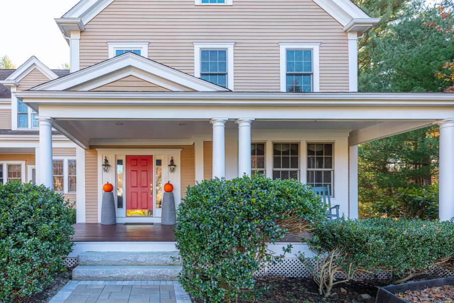 Porch and red front door on newly painted home Preview Image 1
