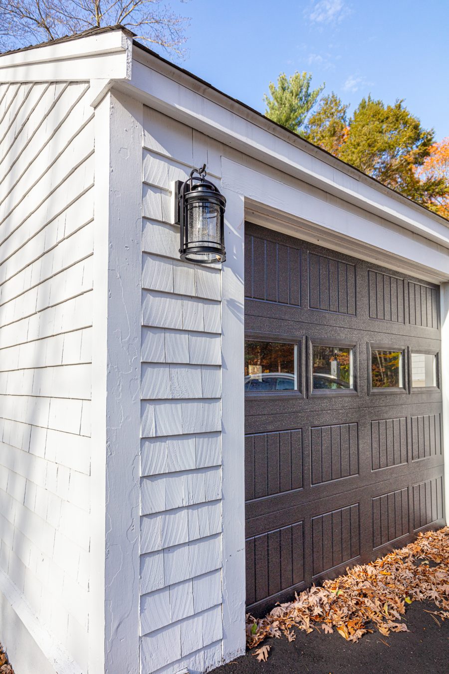 Black garage door on white painted home Preview Image 1