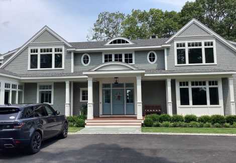 Gray home with white trim in Duxbury