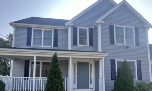 Exterior Painting of Gray Clapboards and Dark Shutters