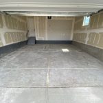 wide angle view of a bad garage floor
