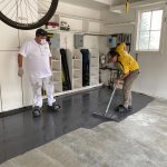 Certapro team cleaning residential garage floor