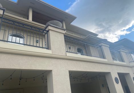 house with deck and metal railings