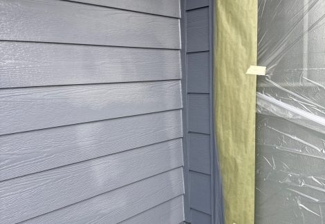 house siding with protective covering on trim