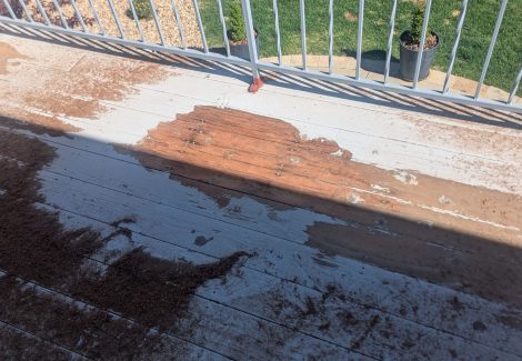 wooden deck with paint partially removed