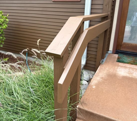 stained outdoor step railing