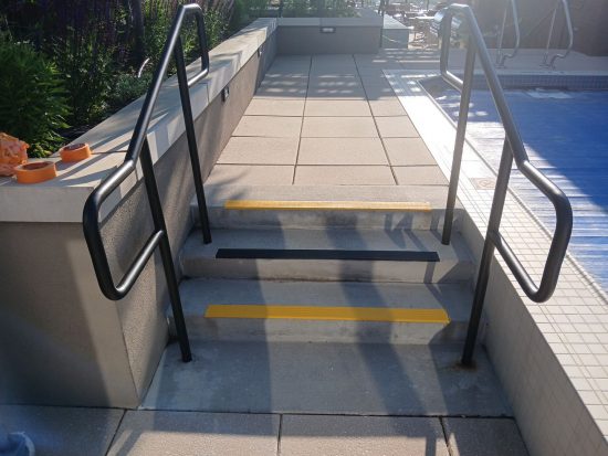 concrete steps with anti-slip and safety paint strips