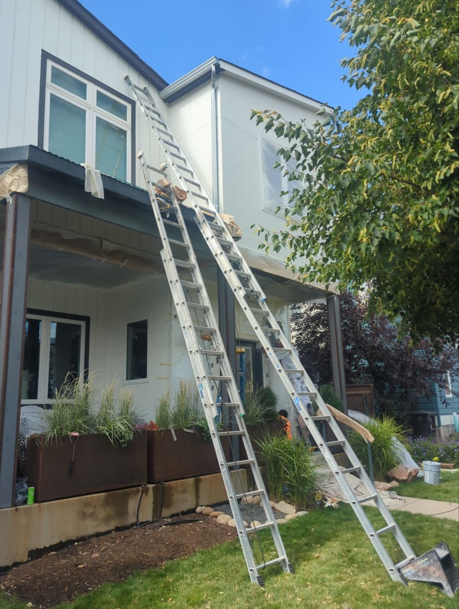ladders againts house exterior during repaint Preview Image 15