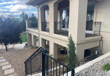 house with deck and metal railings