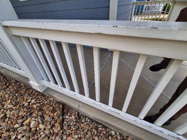 wooden patio railing with worn paint Preview Image 5