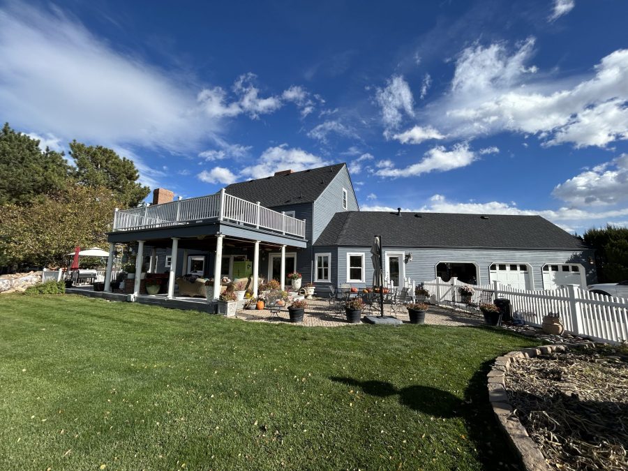 back of grey painted house with raised deck and back yard Preview Image 3