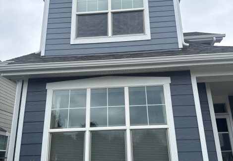 front of house with grey-blue siding and white trim