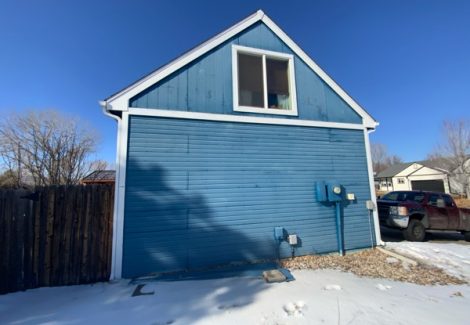 faded blue painted house