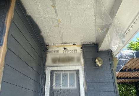 house siding with protective covering on trim