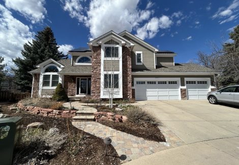 front exterior of house with stone and painted siding