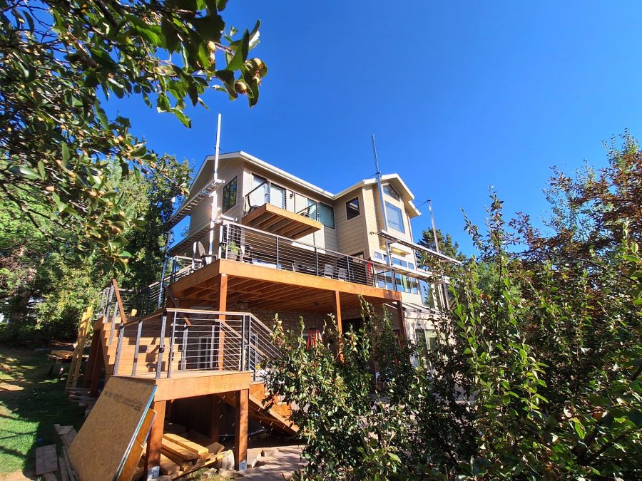 house with attached deck and wooden steps Preview Image 9