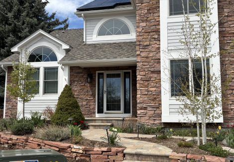 front exterior of house with stone and painted siding