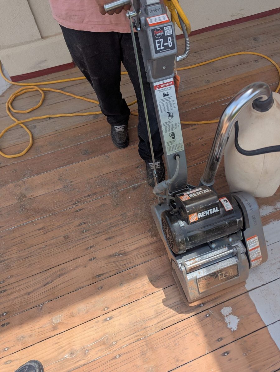 painter stripping old paint from wooden deck with equipment Preview Image 17