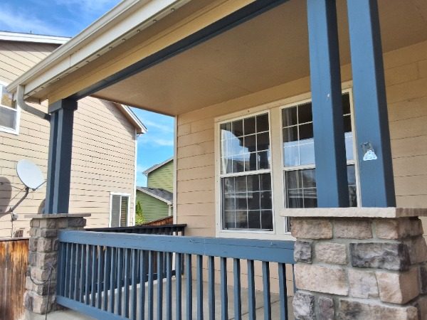blue porch railing with paint damage Preview Image 9