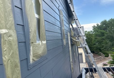 ladder against house during siding repaint