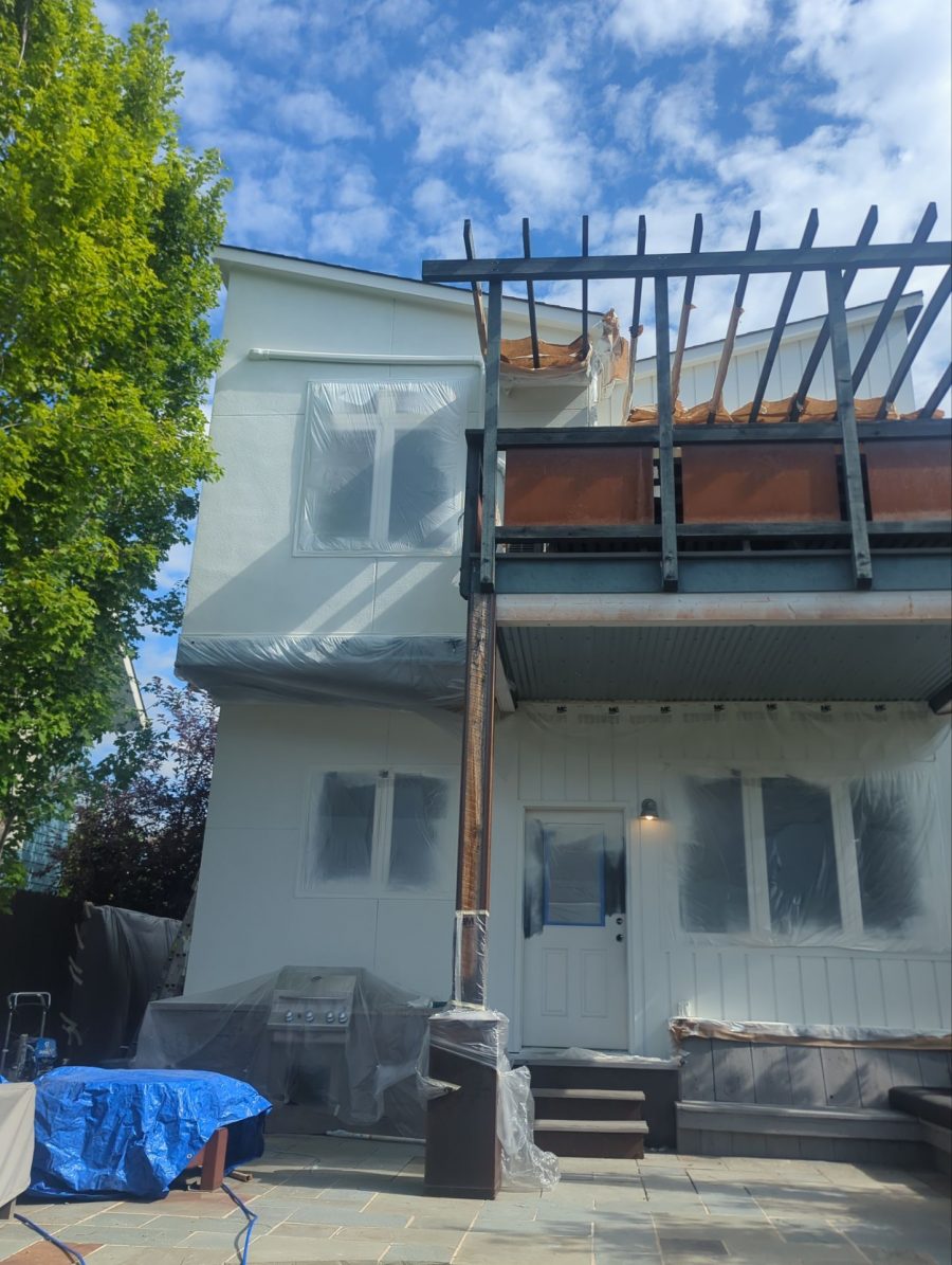 home exterior with protective covering during repaint Preview Image 18
