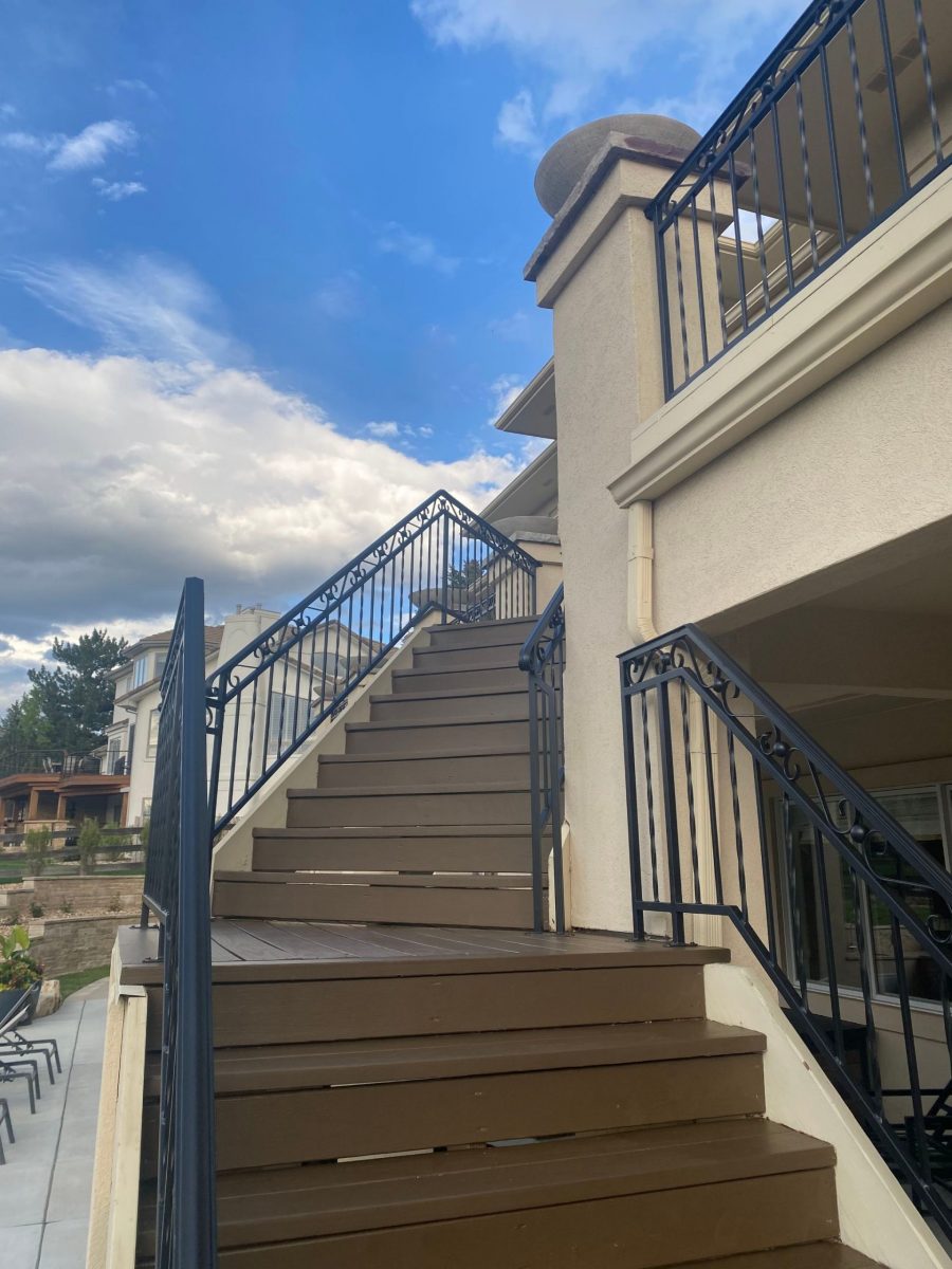 stained wooden deck staircase with black metal railing Preview Image 3