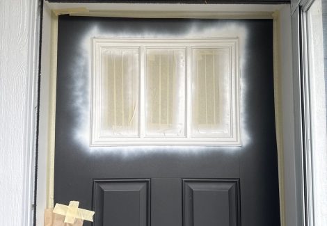 door with window covers and primer