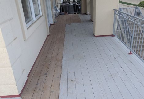 wooden deck with paint partially removed