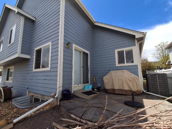 back of house with blue siding Preview Image 3