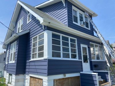 house painted dark blue with white trim